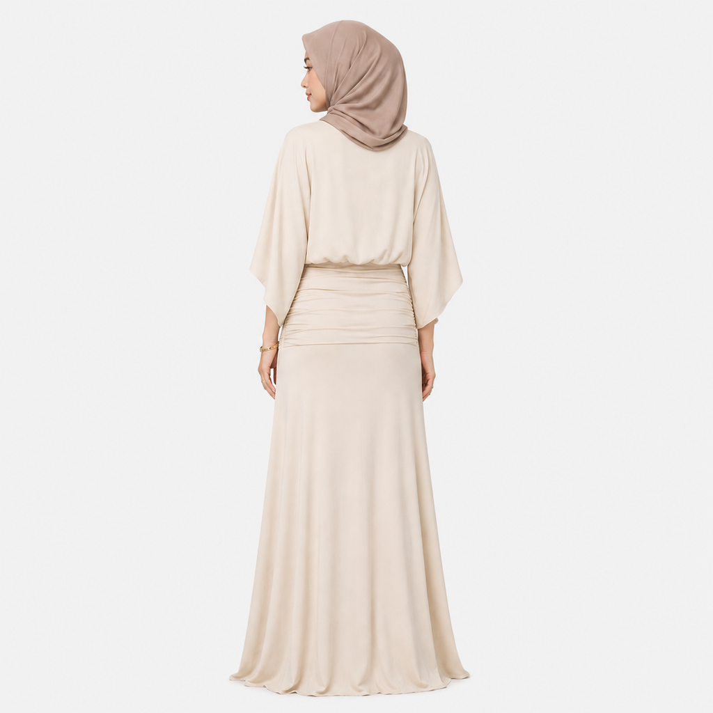 Woman wearing a beige hijab and dress on a white background