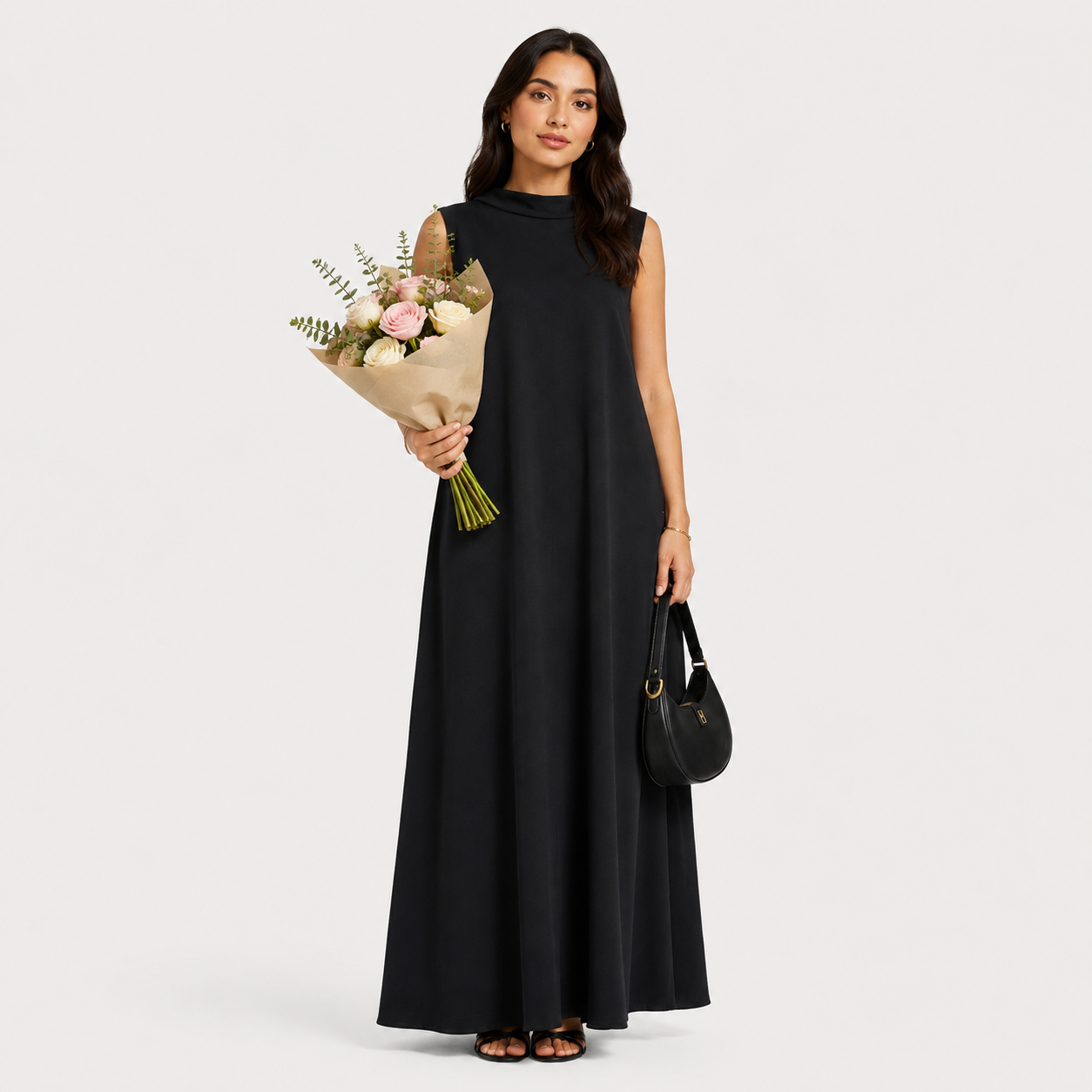 Woman holding a bouquet of flowers against a plain background