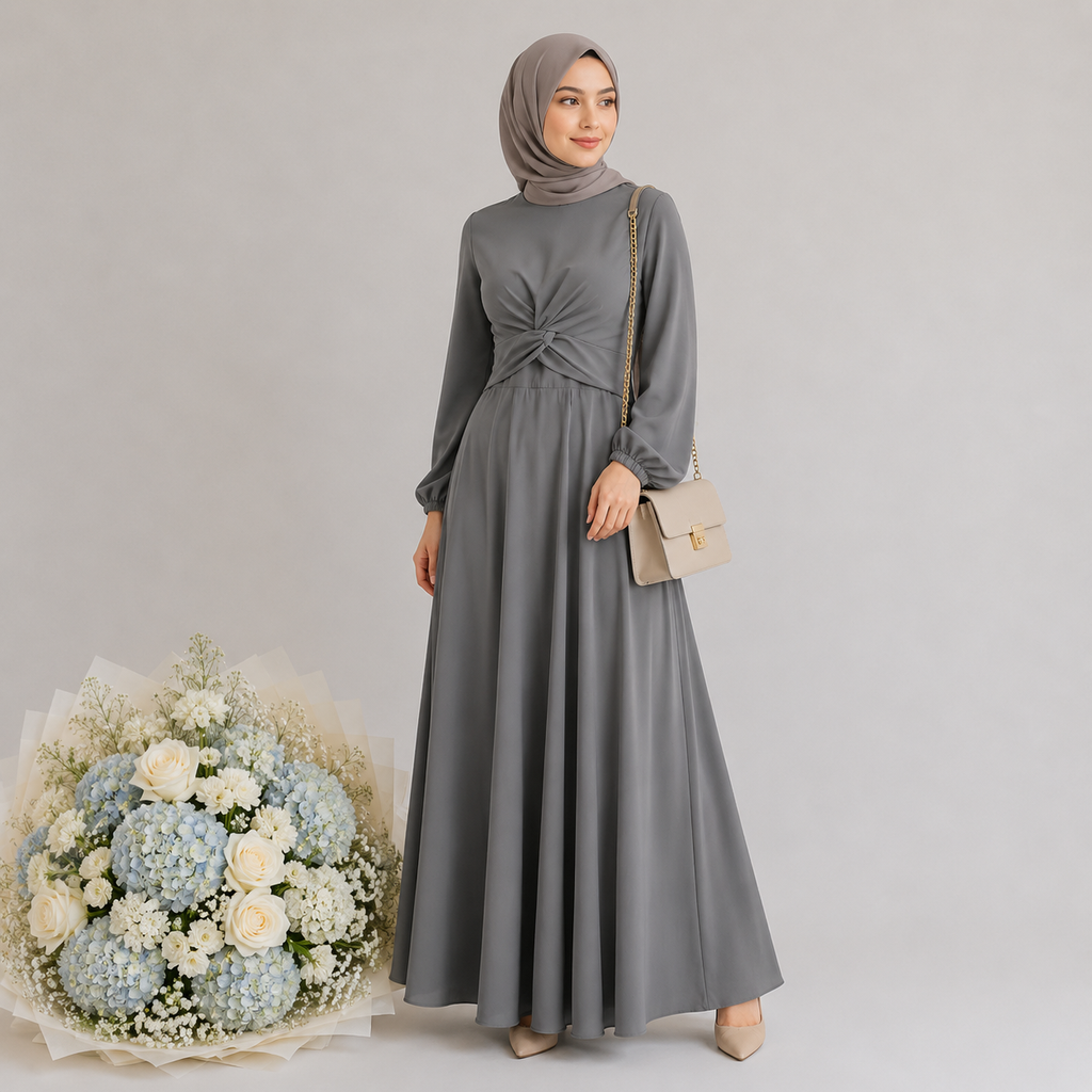 Woman in a gray dress with a hijab holding a beige handbag, standing next to a bouquet of flowers on a plain background.