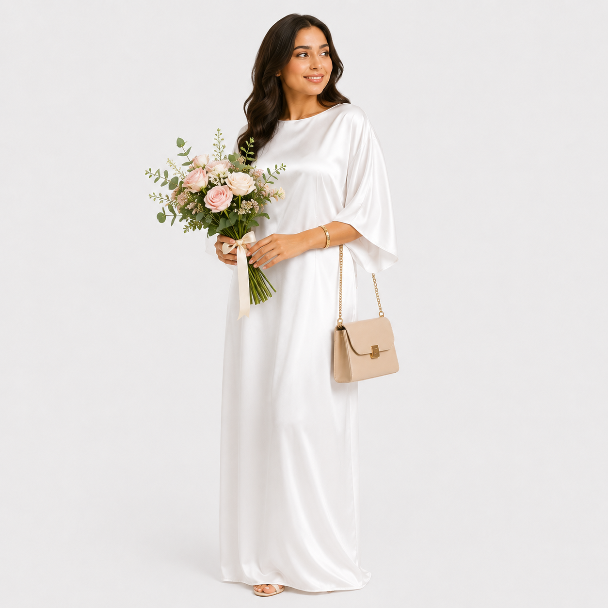 Woman in a white dress holding a bouquet of flowers and a beige handbag on a white background