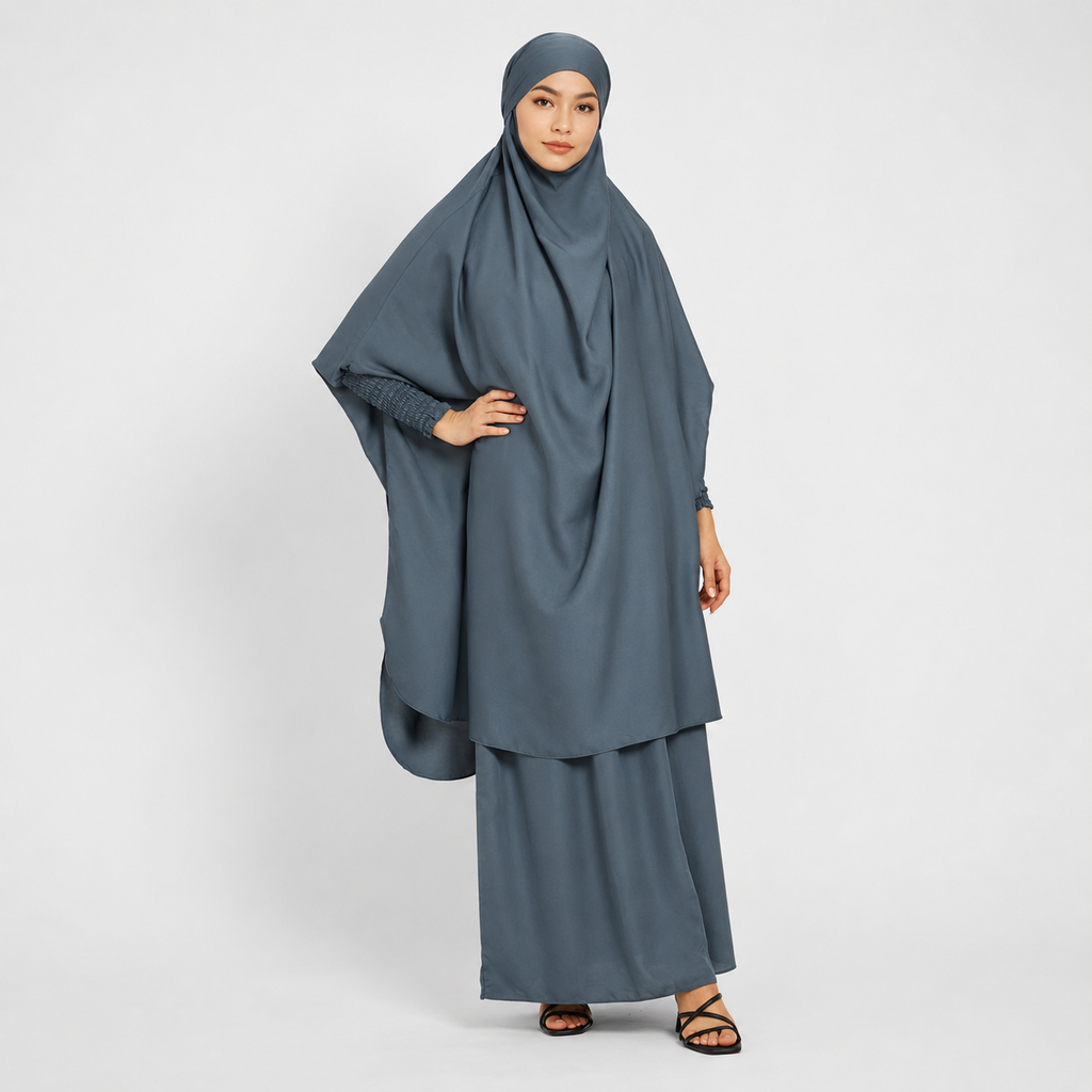 Woman wearing a gray traditional outfit on a white background