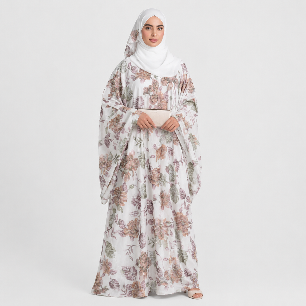 Woman wearing a floral abaya on a white background