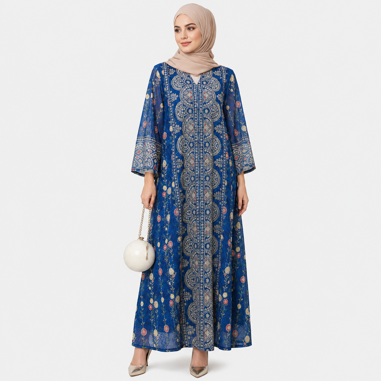 Woman wearing a blue patterned dress on a white background
