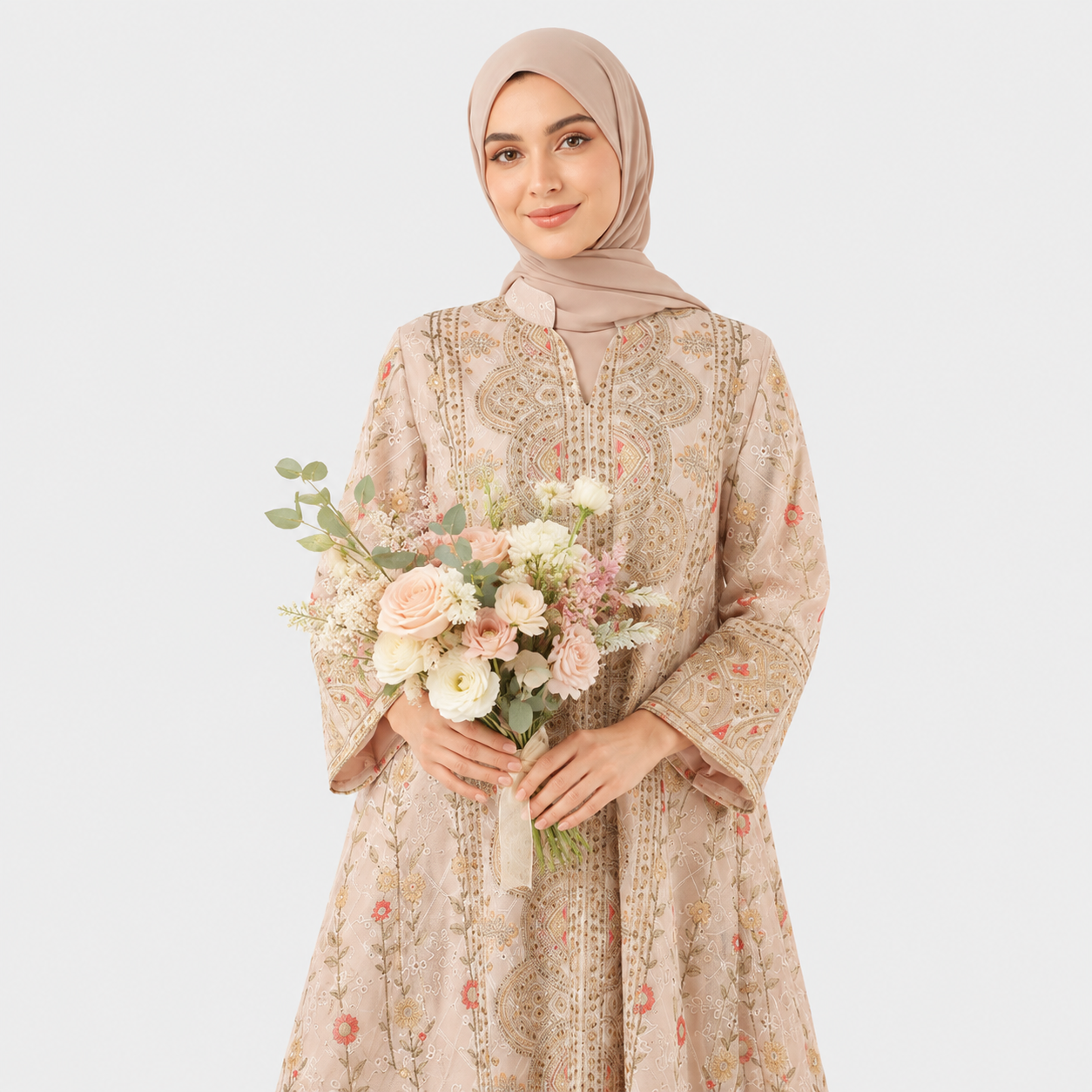Woman in a floral dress holding flowers against a white background