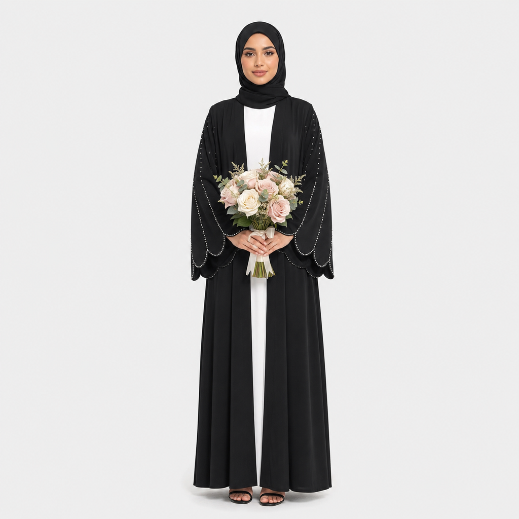 Woman in a black abaya holding flowers on a white background