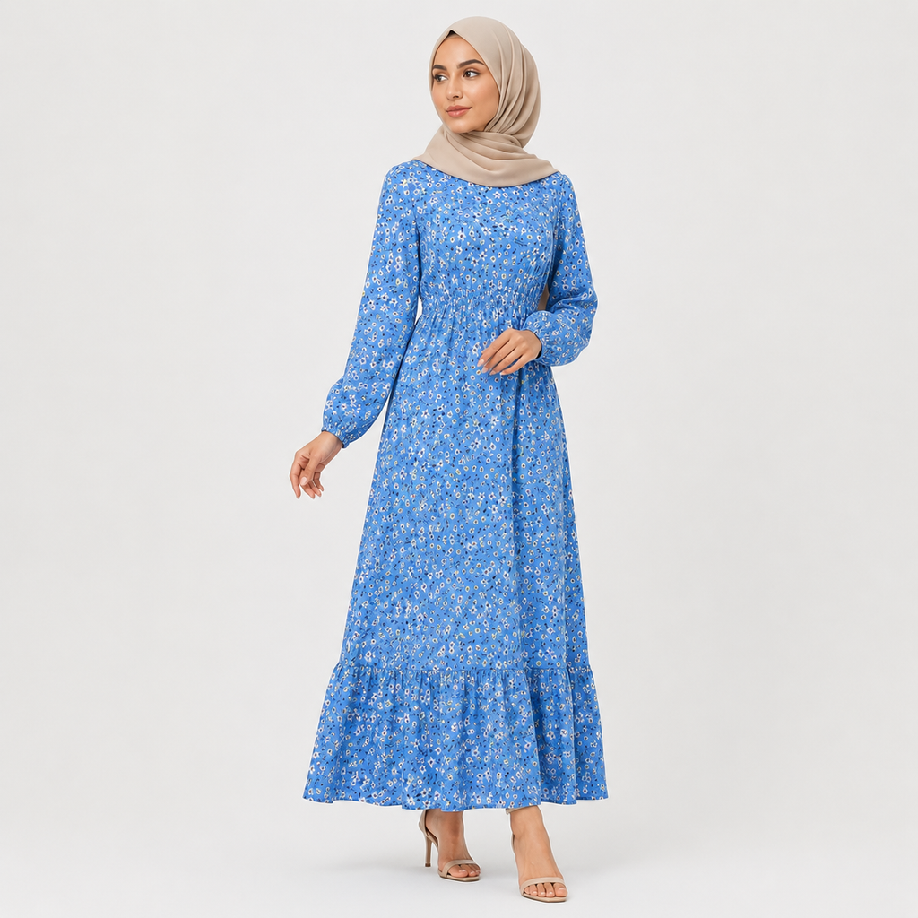 Woman wearing a blue floral dress with a plain background