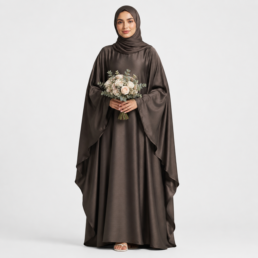 Woman wearing a brown abaya holding flowers on a white background