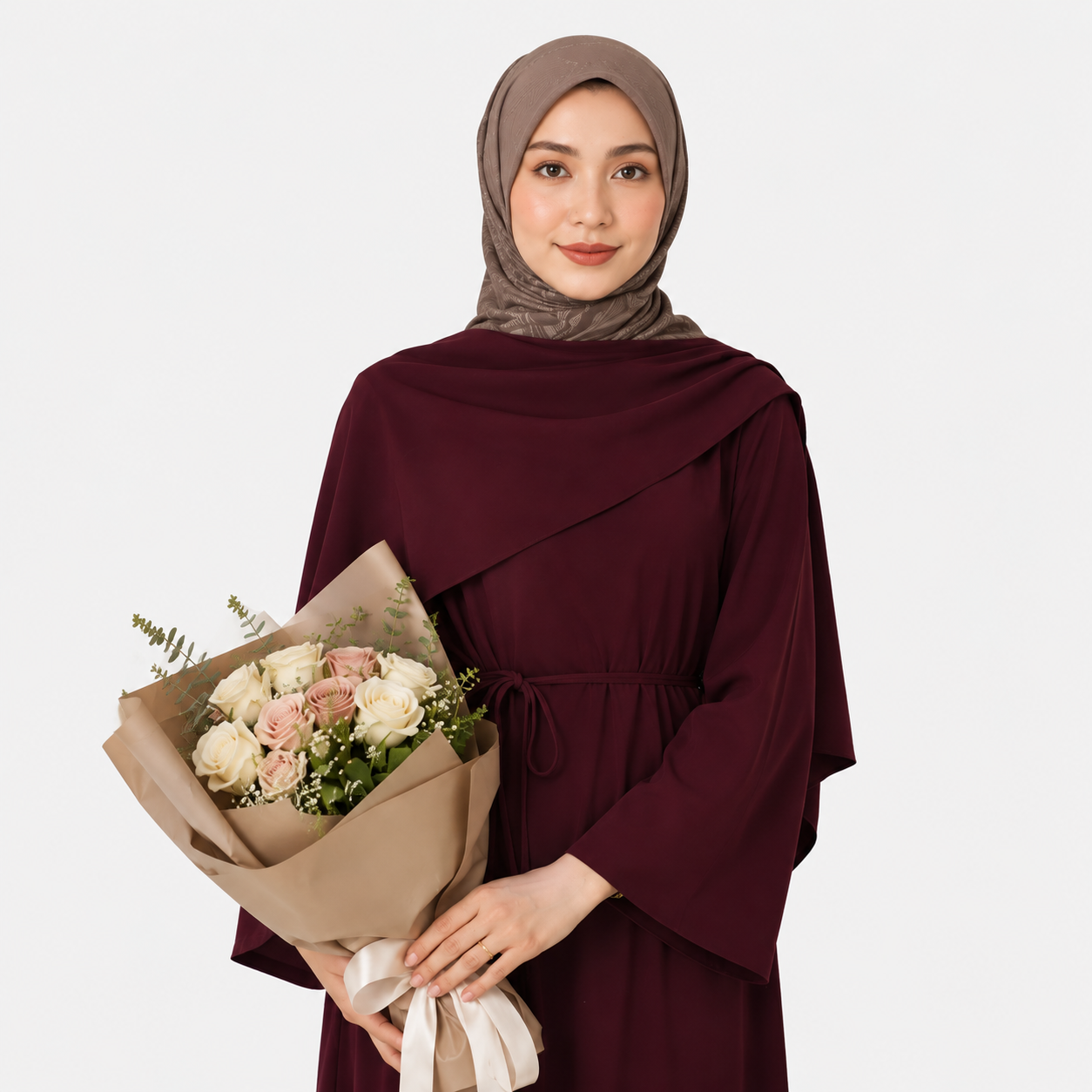 Woman in a burgundy dress holding a bouquet of flowers on a white background