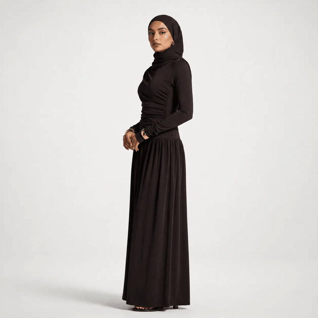 Woman wearing a black outfit on a white background