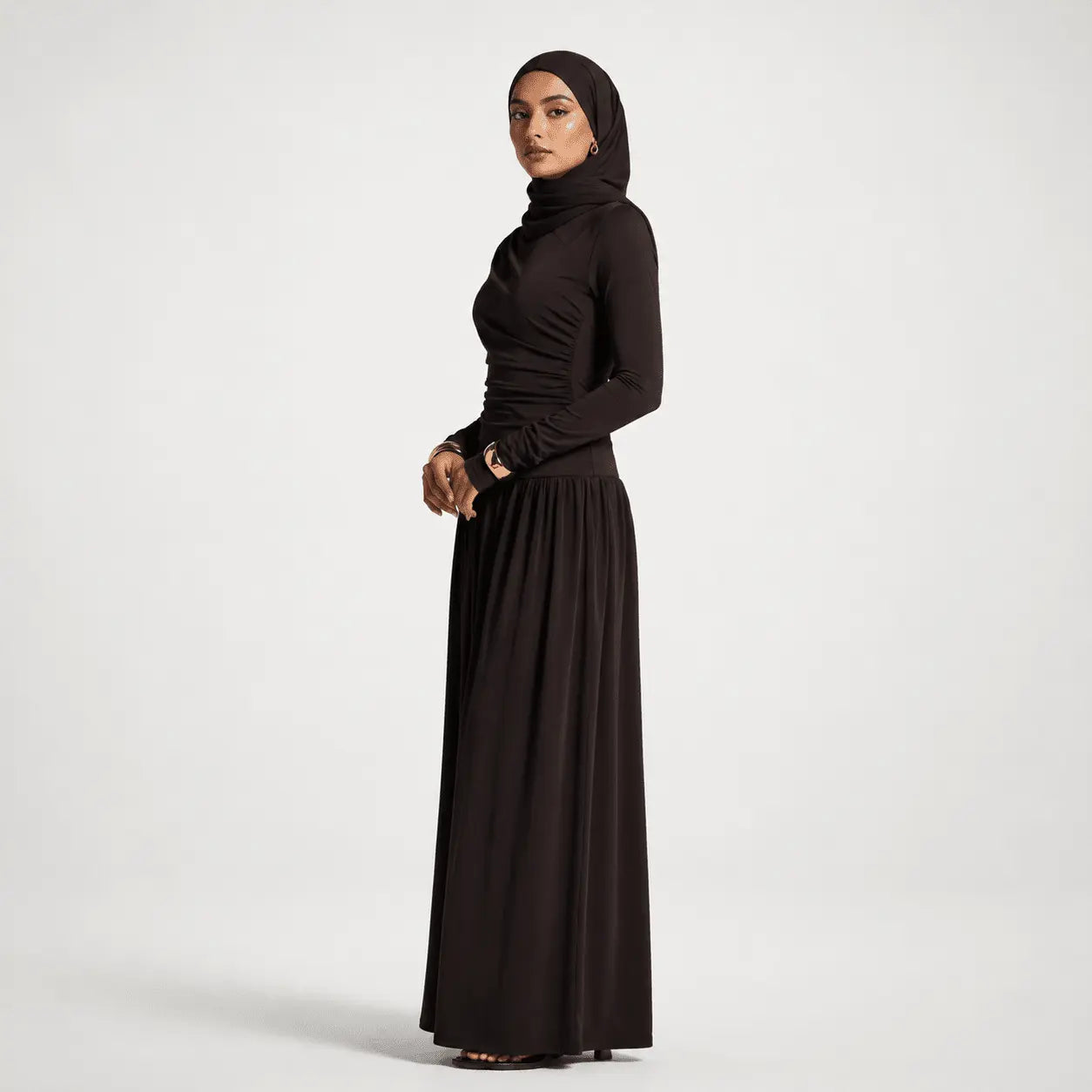 Woman wearing a black outfit on a white background
