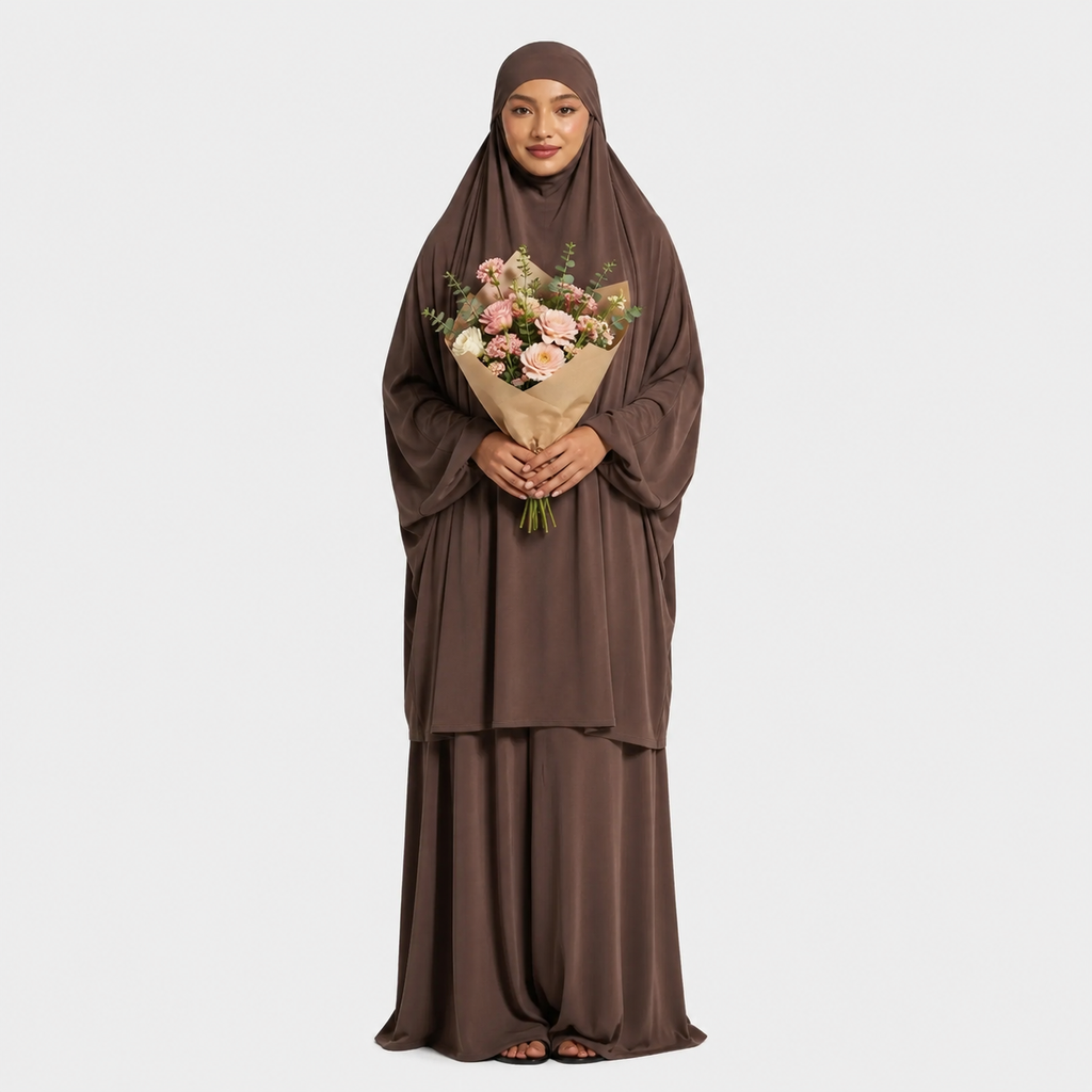 Woman in a brown abaya holding a bouquet of flowers on a white background