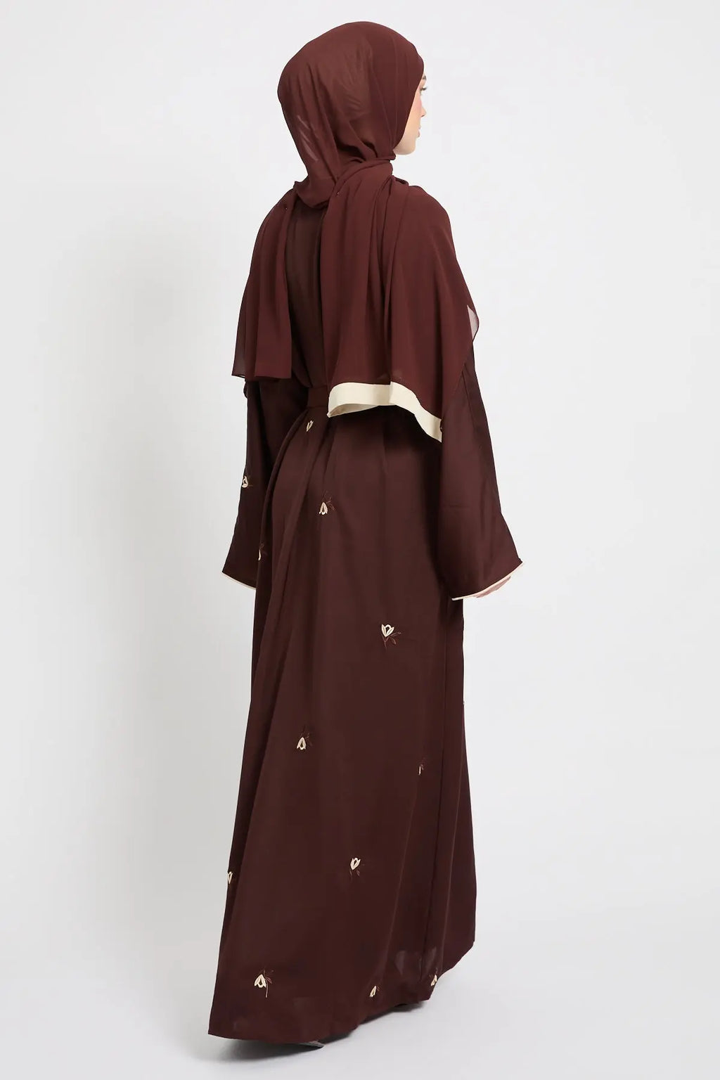 Brown abaya with matching hijab on a white background