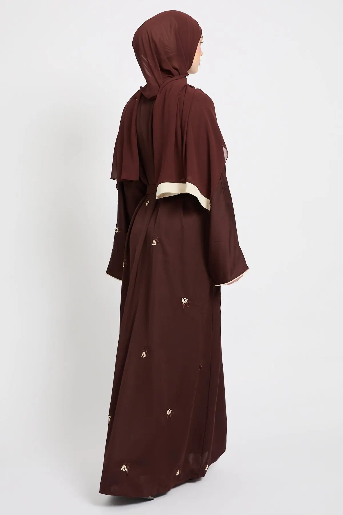 Brown abaya with matching hijab on a white background