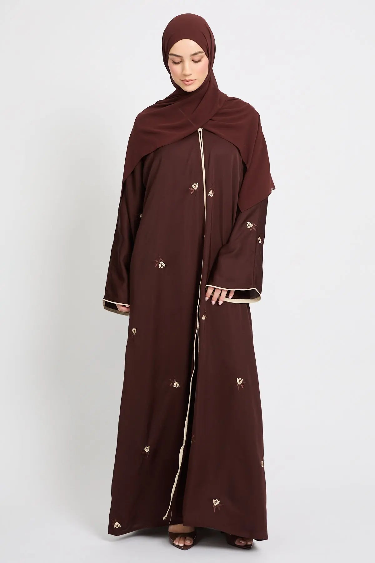 Brown abaya with a matching hijab on a white background