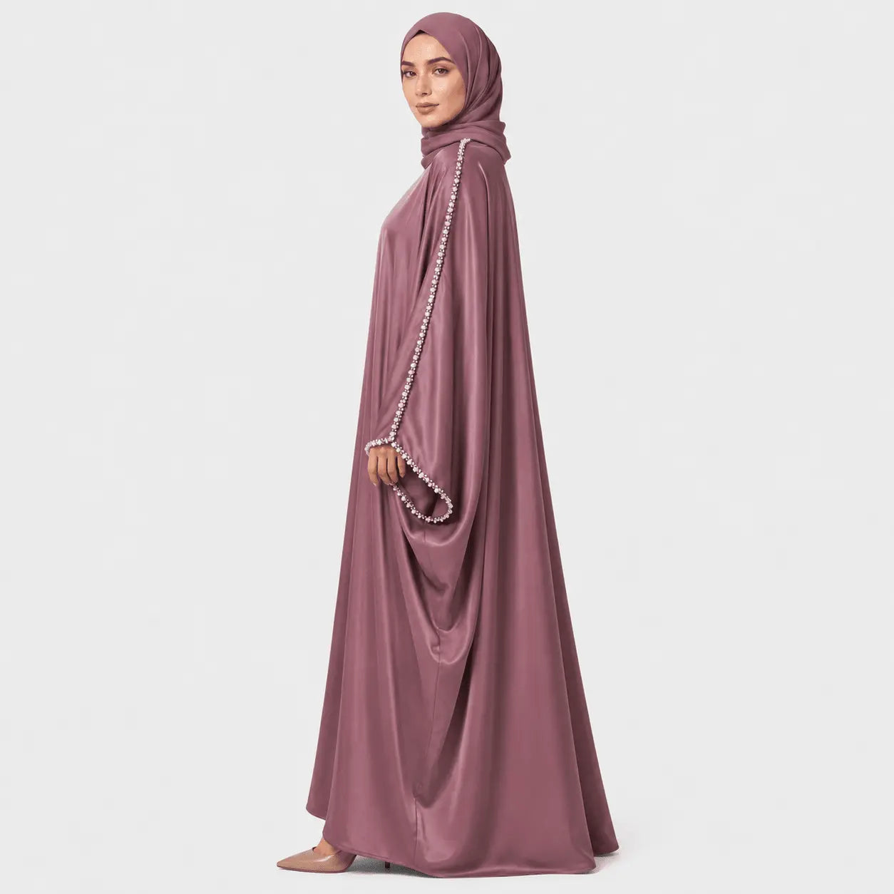 Mauve abaya with pearl details on a white background