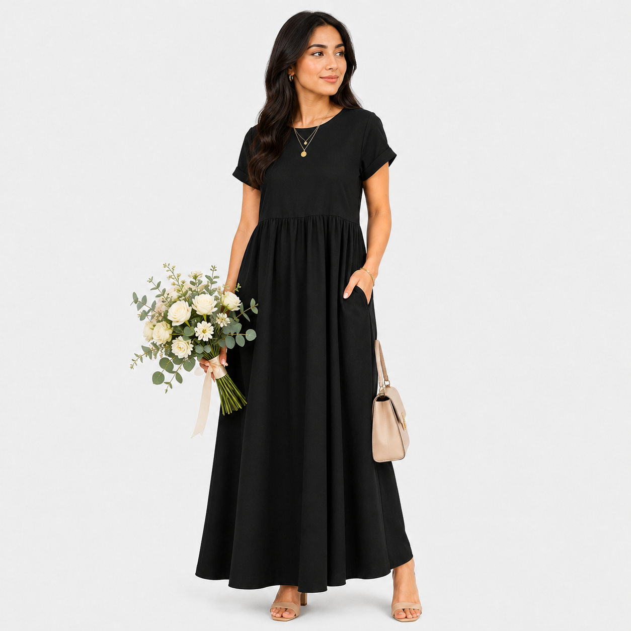 Woman wearing a black dress holding flowers and a handbag on a white background