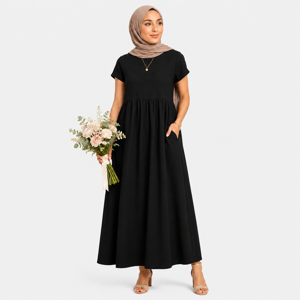 Woman wearing a black dress holding flowers on a white background