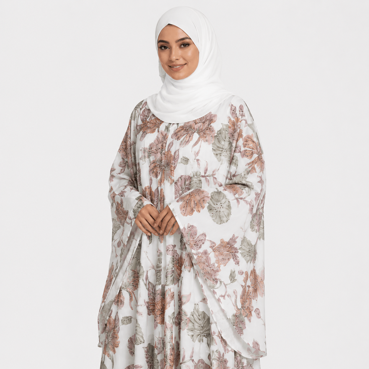 Woman wearing a floral dress with a hijab on a white background