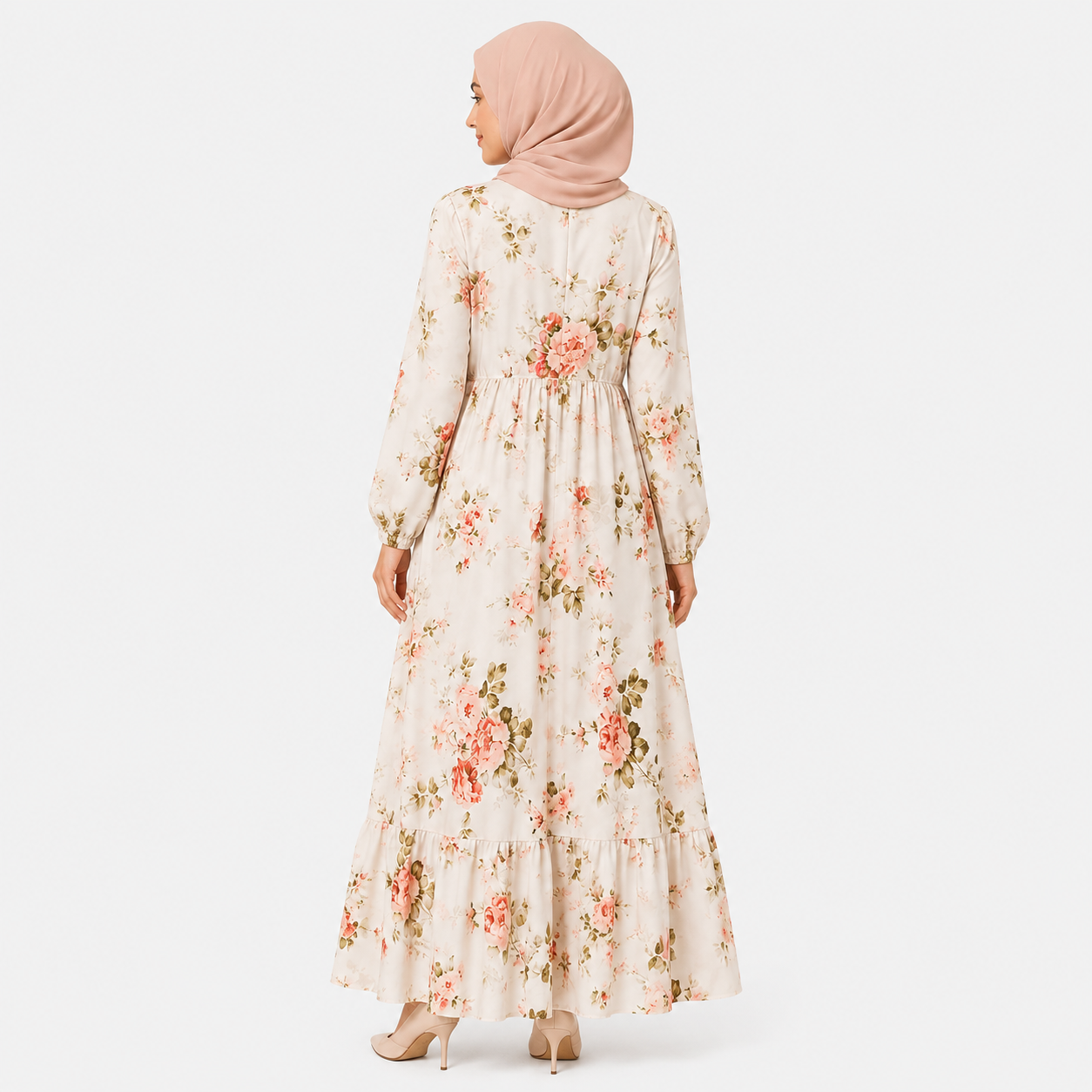 Woman wearing a floral dress with a plain background