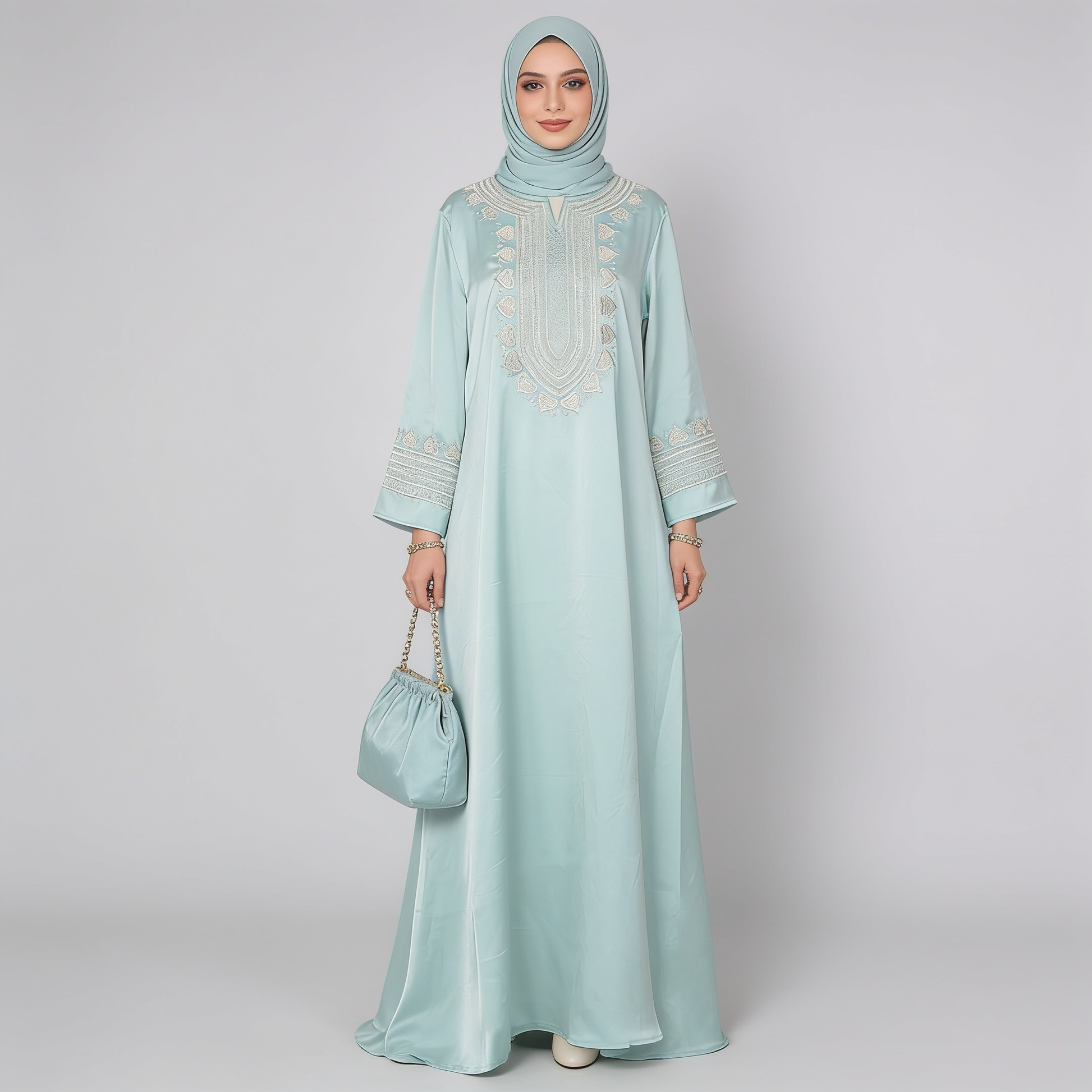 Woman wearing a light blue dress with beige embroidery on a white background