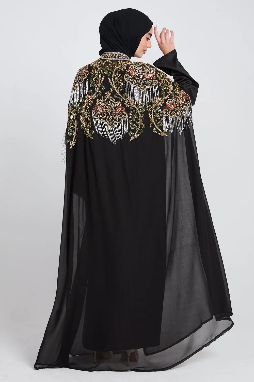 Black abaya with floral embroidery and beads on a white background
