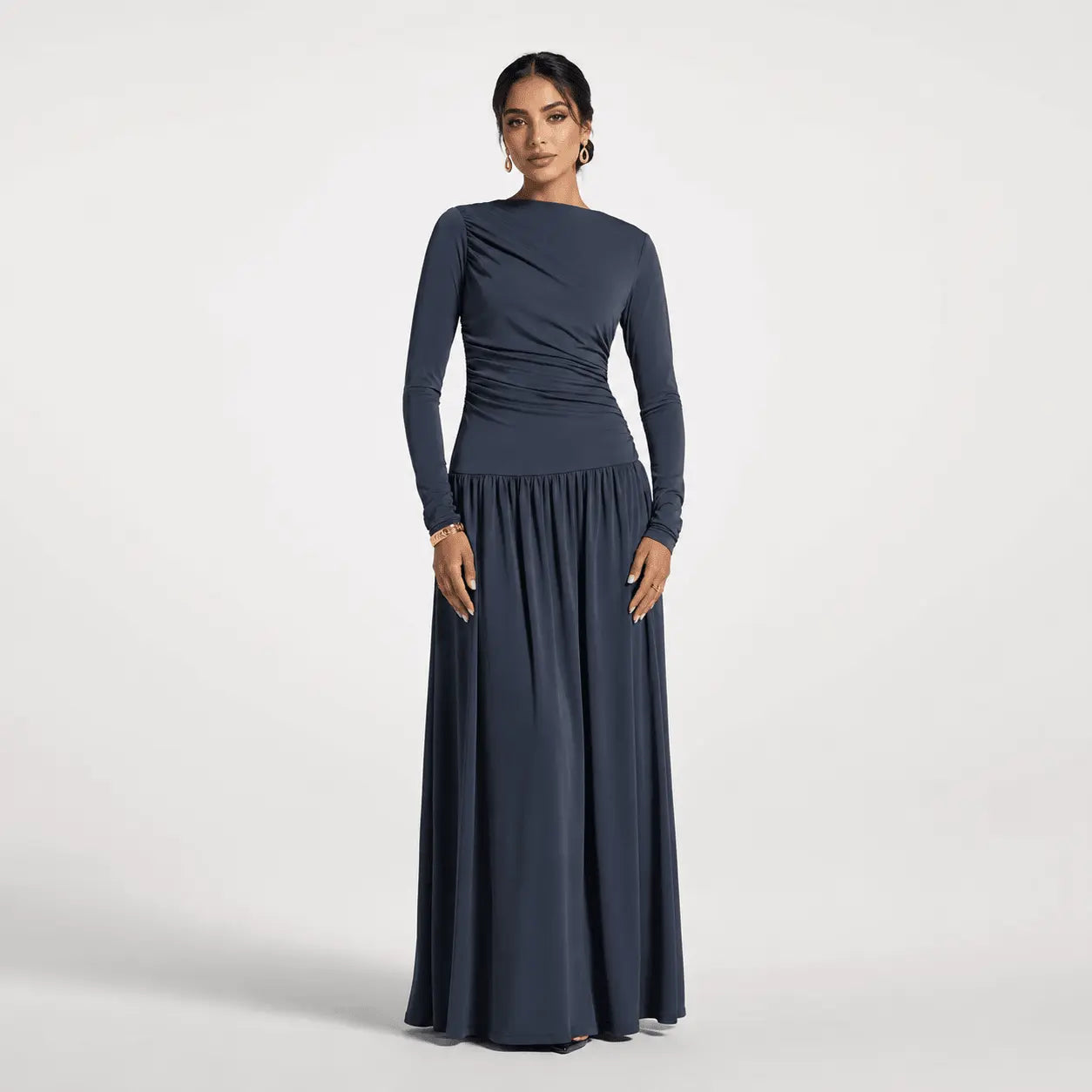 Navy blue long sleeve maxi dress with ruched bodice and flowy skirt for formal events