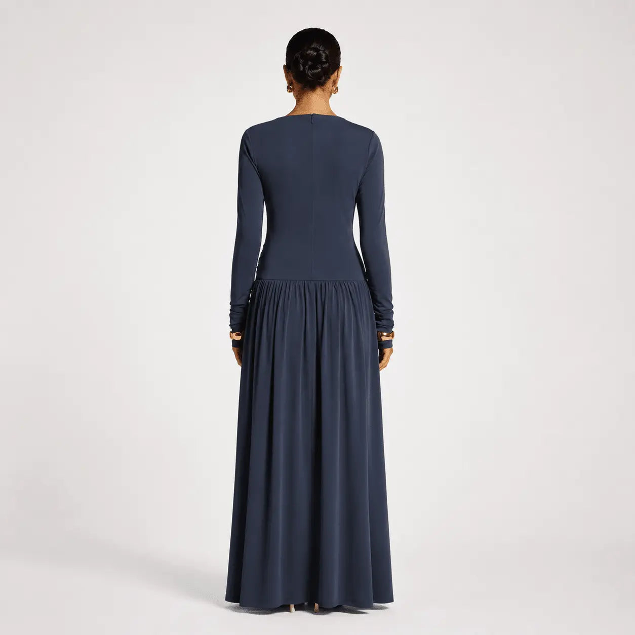 Navy blue long sleeve maxi dress with pleated skirt, elegant back view