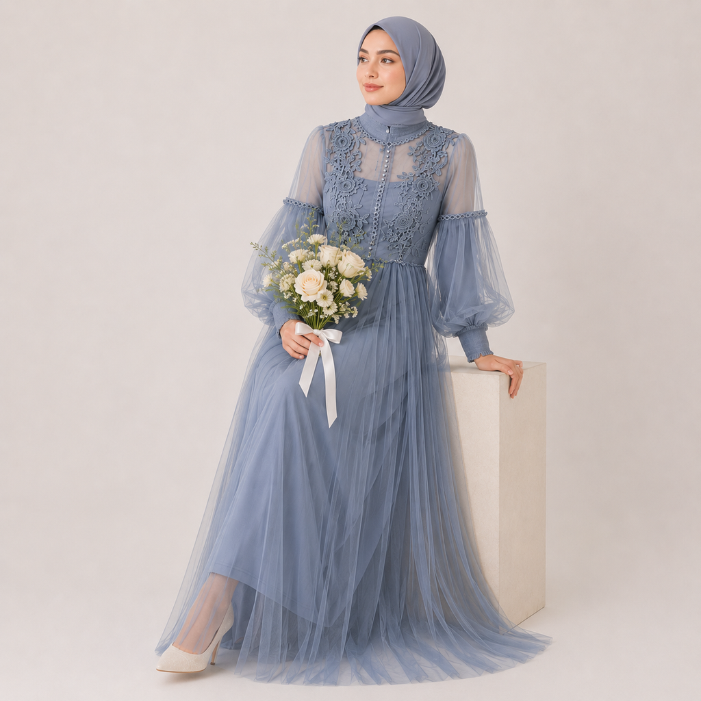 Woman in a blue dress holding flowers against a white background