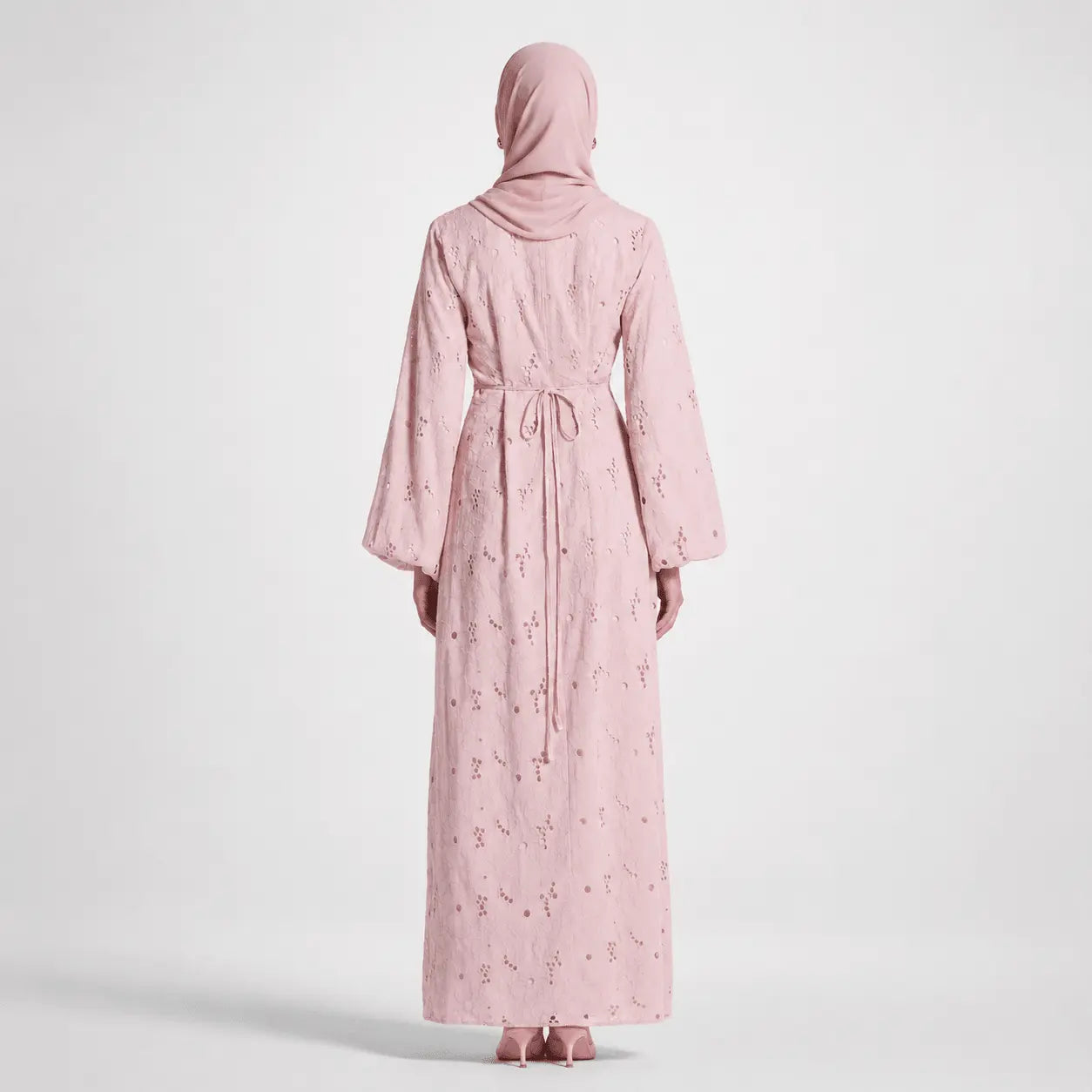 Pink modest abaya with lace detailing and hood, back view