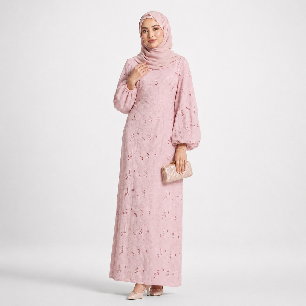 Woman wearing a pink floral dress and hijab on a white background