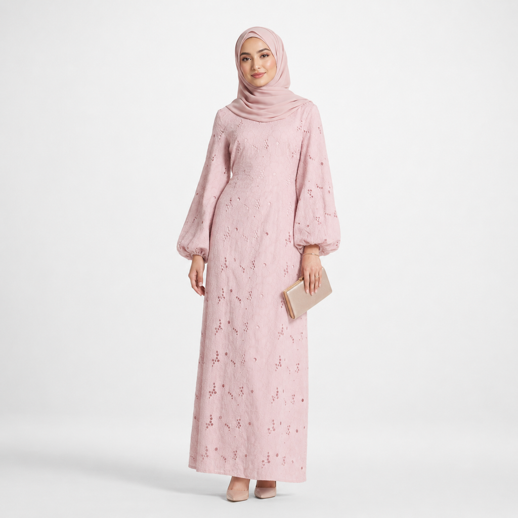 Woman wearing a pink floral dress and hijab on a white background