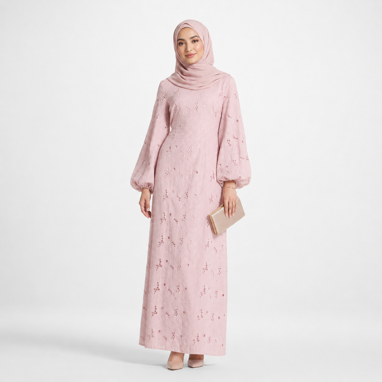 Woman wearing a pink floral dress and hijab on a white background