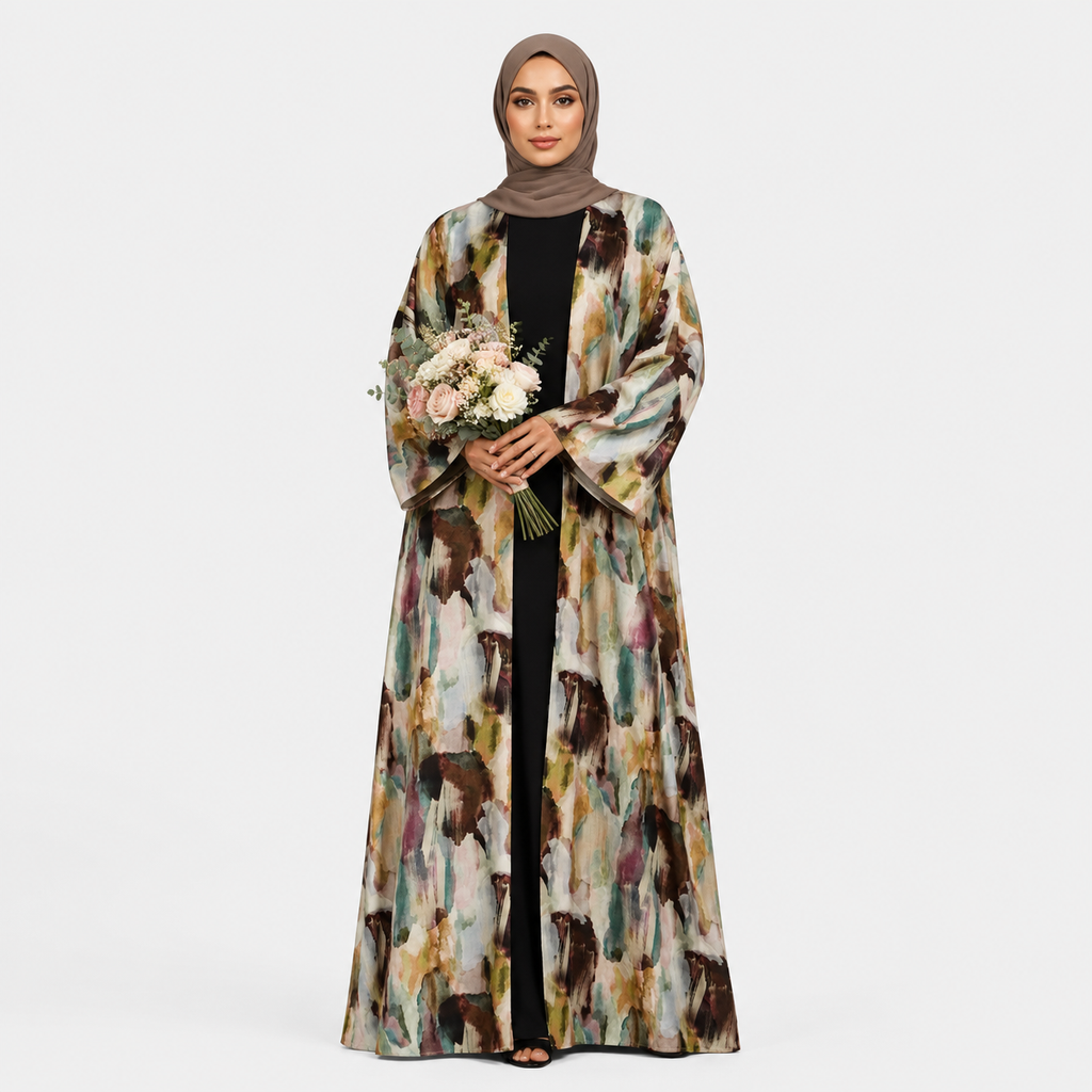 Woman wearing a long, patterned coat holding flowers on a white background
