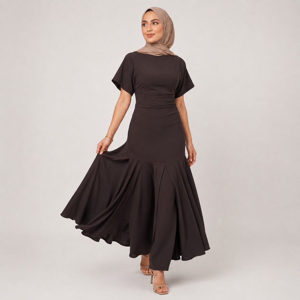 Woman wearing a black dress with a beige hijab on a white background