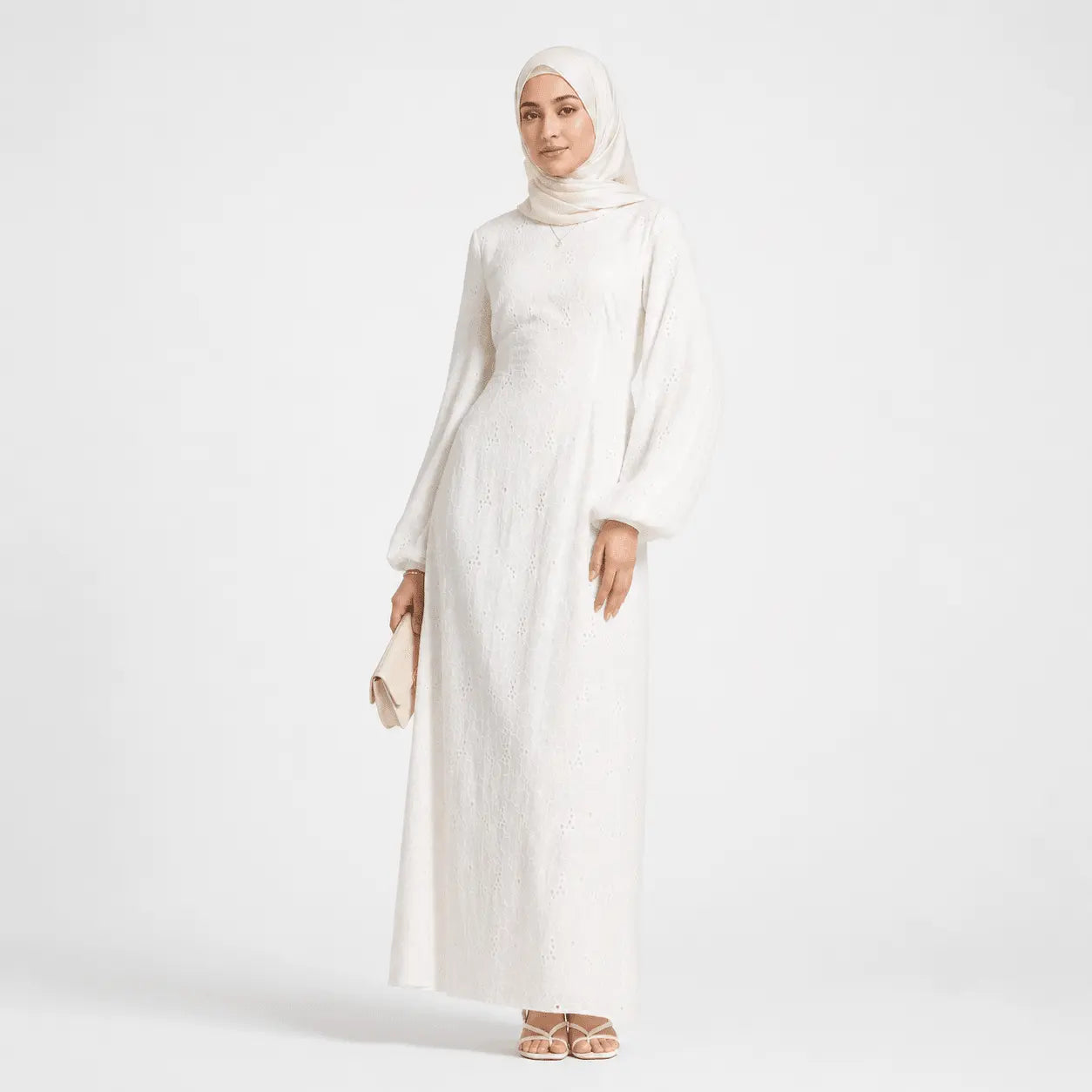 White modest long-sleeve abaya with lace detailing, paired with matching hijab and clutch