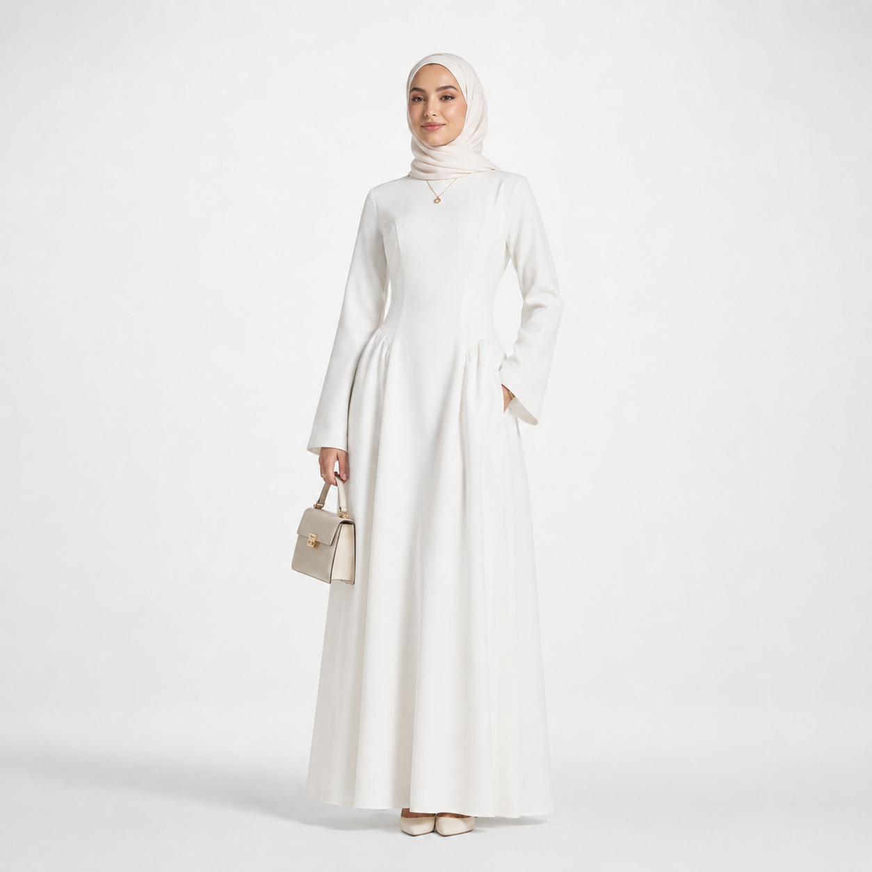 Woman wearing a white dress and hijab holding a beige handbag on a white background
