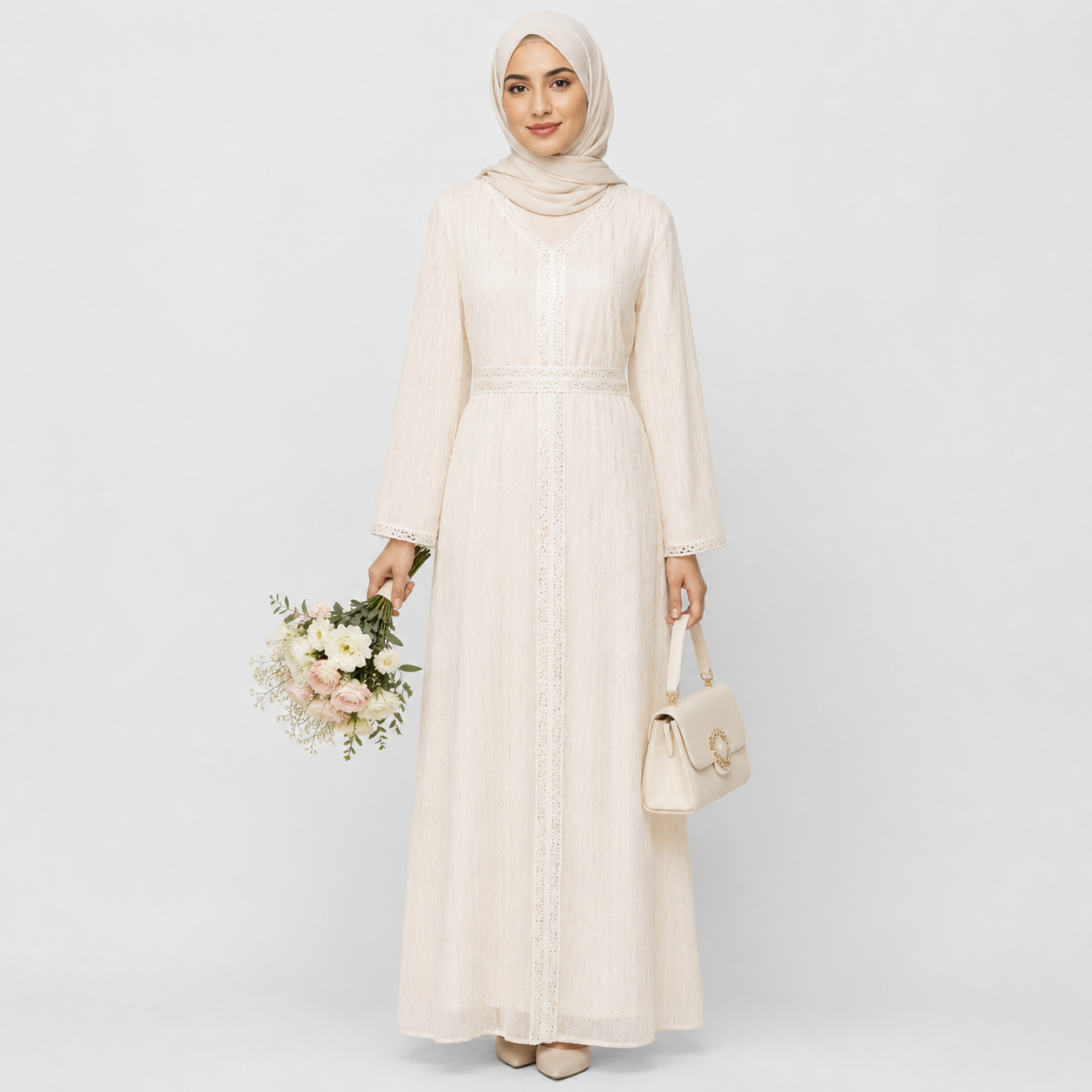 Woman in white lace modest dress with hijab, elegant long sleeves, and soft fabric texture