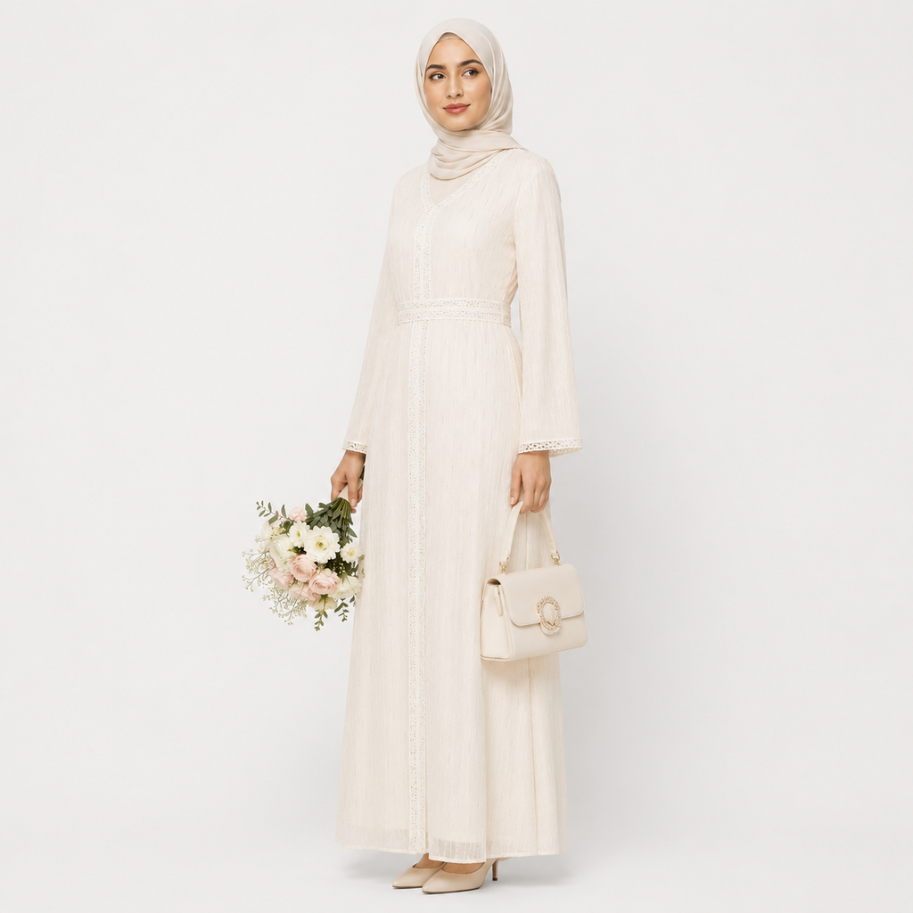 Woman in white lace modest dress with hijab, elegant long sleeves, and soft fabric texture