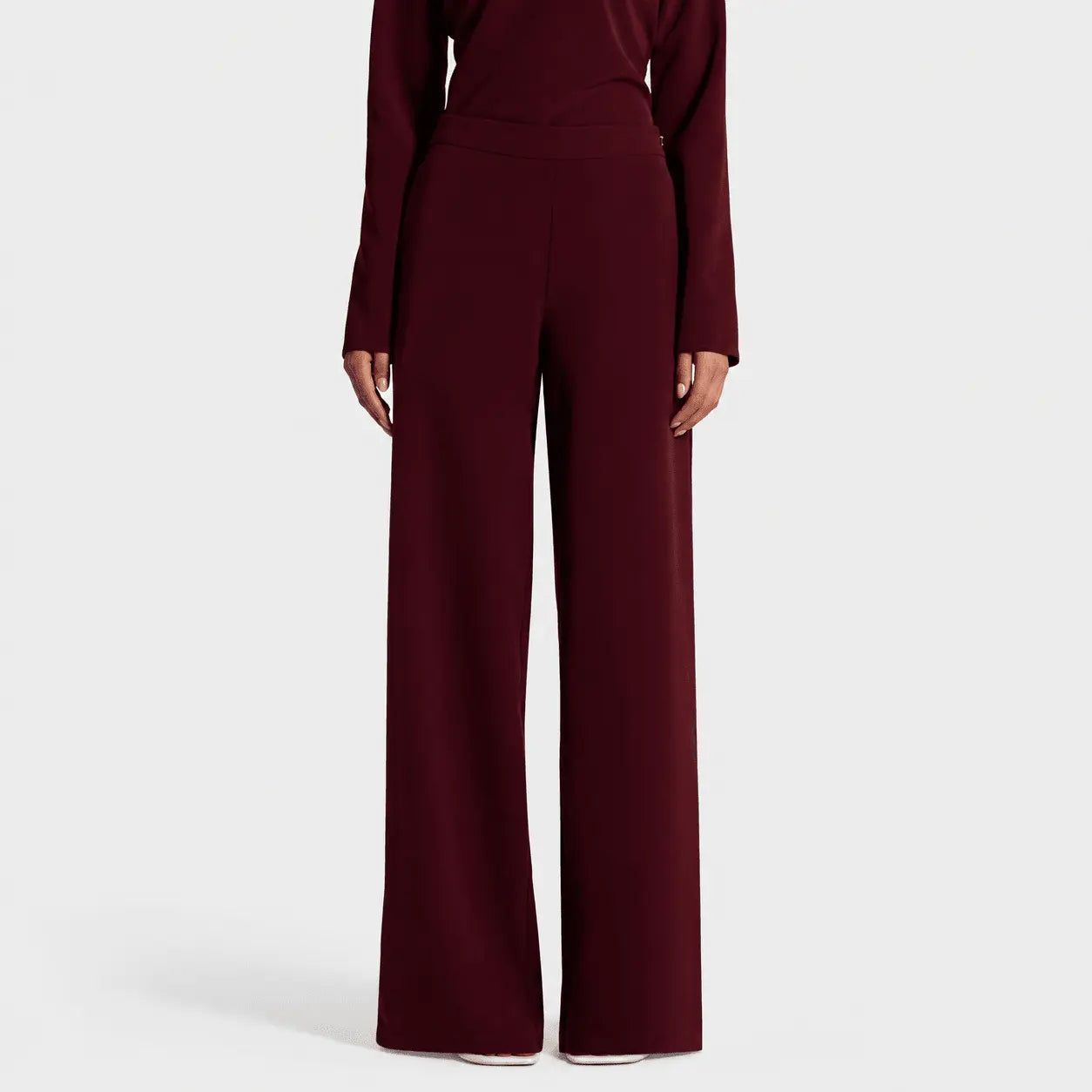 Maroon jumpsuit on a white background
