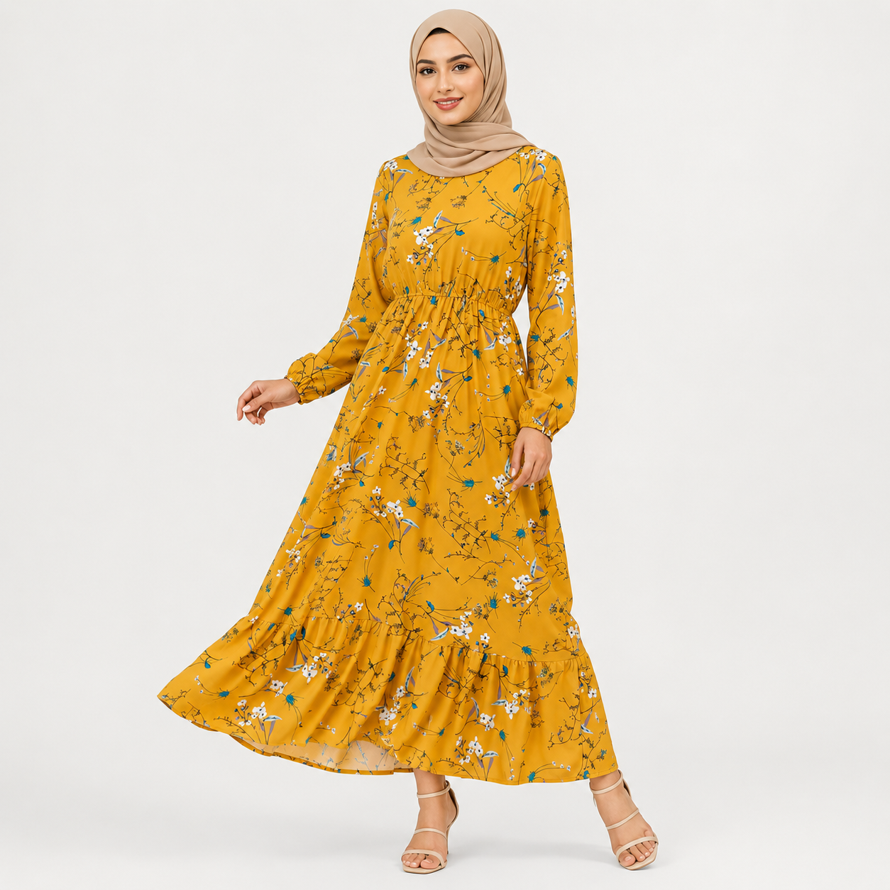 Woman wearing a yellow floral dress on a white background