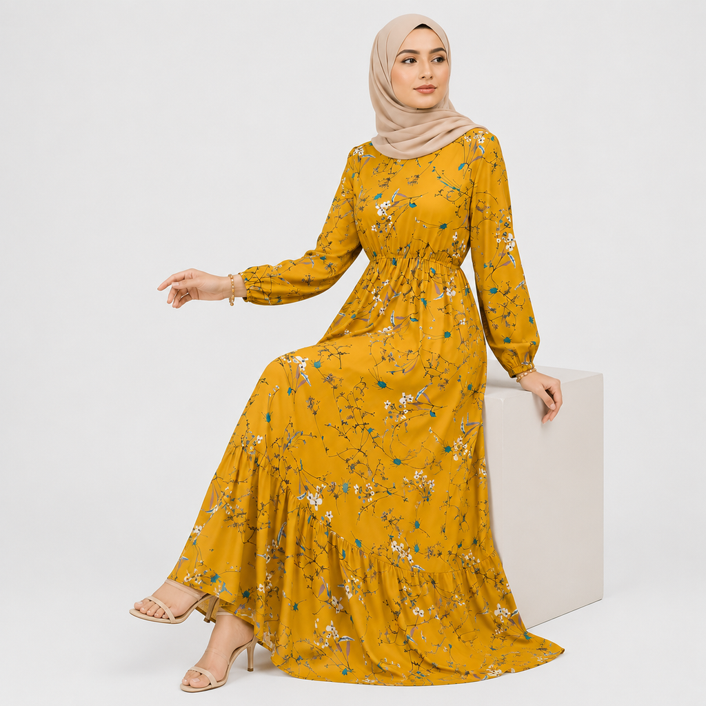 Woman wearing a yellow floral dress and hijab on a white background